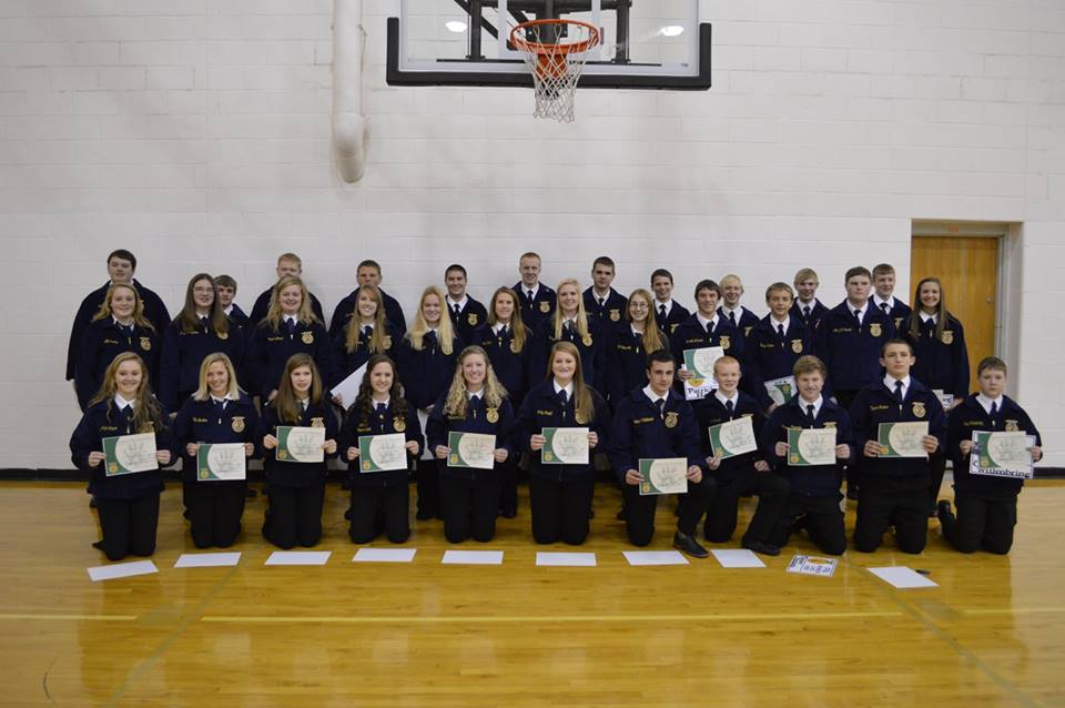 Students posing with Greenhand award